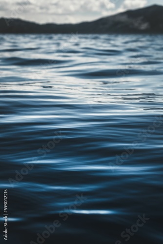 Vertical closeup of dark blue water texture at Lake Tahoe, California