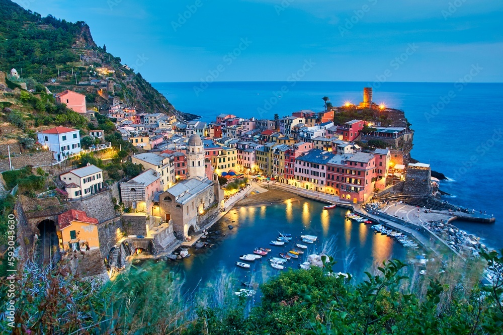 Colorful building of the Vernazza town in Cinque Terre Italy surrounded by the calm sea