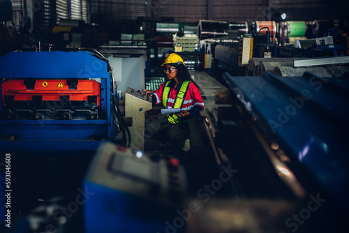 Foreman or worker work at factory site check up machine or products in site. Engineer or Technician checking Material or Machine on Plant. Industrial and Factory. © kanpisut