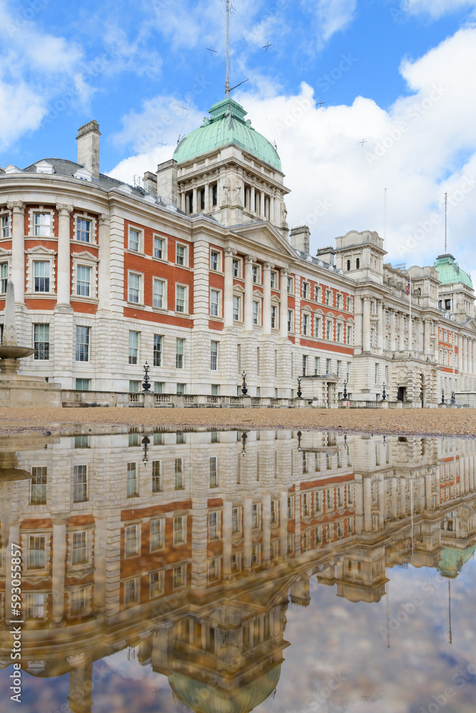 Old Admiralty Building London reflects in a puddle on Horse Guards Parade