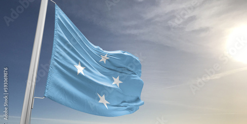 Micronesia, Federated States of Micronesia national flag cloth fabric waving on beautiful sky grey Background.