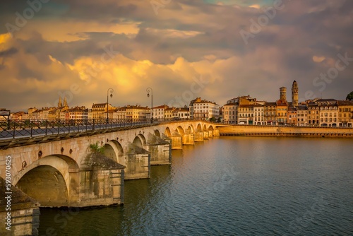 Macon, France - 6/9/2015:  The historic Saint-Laurent Bridge over the Soane river.  It was among the few bridges of the region that were not destroyed during the Second World War. © Bob