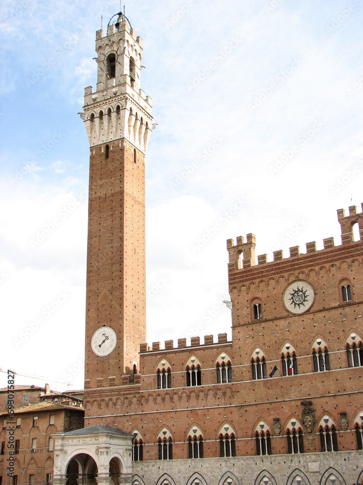 Siena, Italy - Torre del Mangia, a tall tower on Piazza del Campo, the main square in the Tuscan city of Siena, Italy.  Image has copy space.