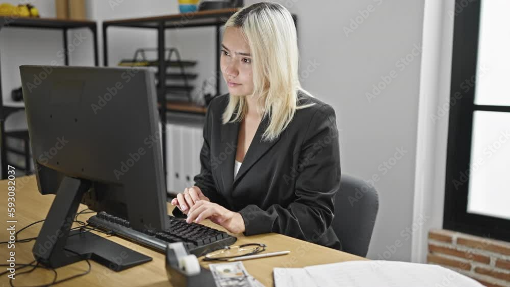 Young beautiful hispanic woman business worker using computer counting dollars working at office Young beautiful hispanic woman business worker using computer counting dollars working at office