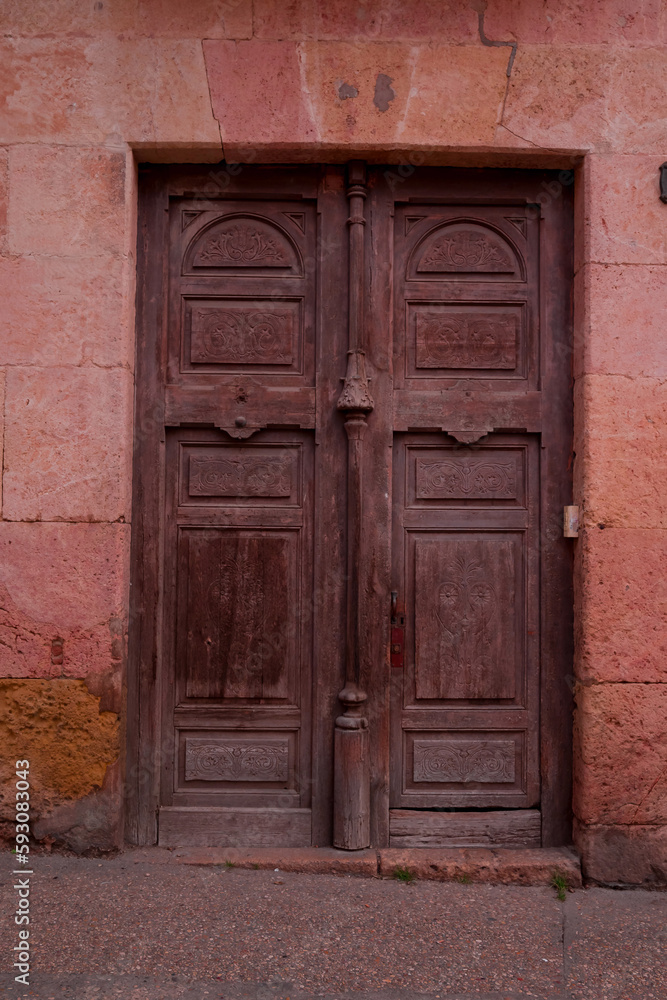 An ancient house doors in old town, Spain