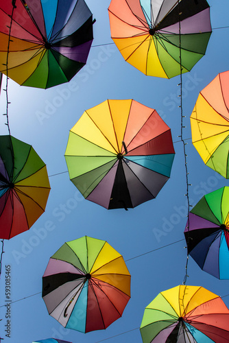 View from below  colorful hangin umbrellas in a small city  decoration