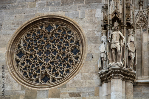 Artistic window of a christian church with sculptures