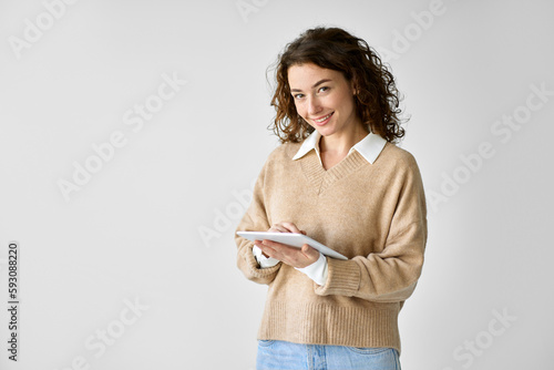 Young smiling professional business woman or student holding digital tablet, using tab computer standing isolated at white background advertising online education on smart technology device.