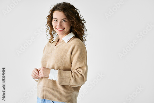 Young adult smiling beautiful charming positive professional woman model, joyful satisfied pretty cheerful cute curly girl student looking at camera, standing isolated at white background, portrait. photo