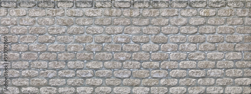 Modern grey brick wall in panoramic format.