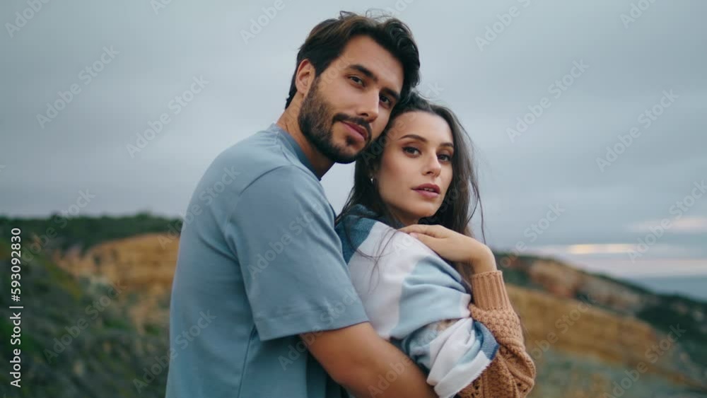 Tender couple posing nature standing in front gloomy cloudy sky together closeup Tender couple posing nature standing in front gloomy cloudy sky together closeup