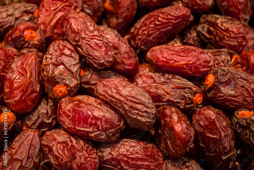 Date Fruits in row, semi dried. Date Fruits in row, semi dried.