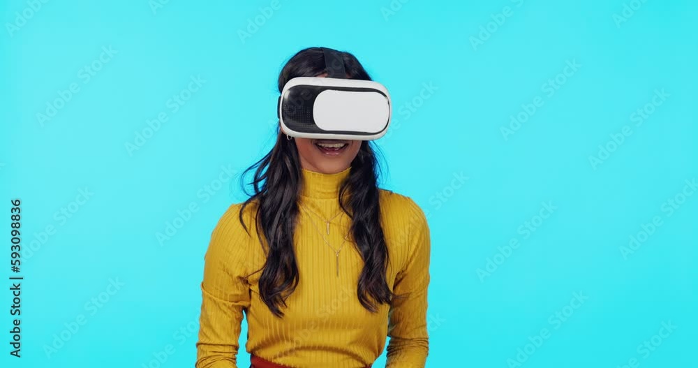 Virtual reality, futuristic and hands of woman on blue background for ai, cyberspace and metaverse. Technology, ux and happy girl with vr glasses in studio for internet, website ui and online gaming Virtual reality, futuristic and hands of woman on blue background for ai, cyberspace and metaverse. Technology, ux and happy girl with vr glasses in studio for internet, website ui and online gaming
