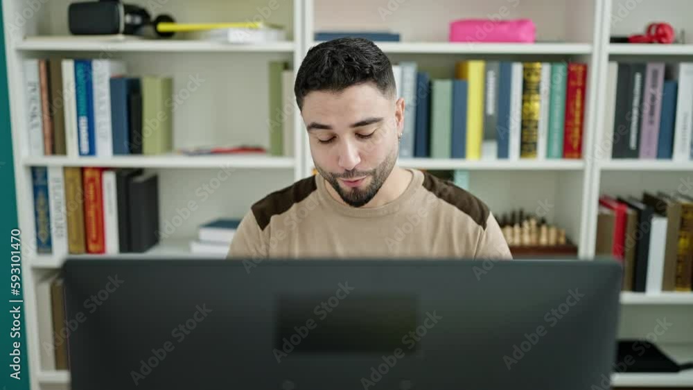 Young arab man student doing video call at university classroom Young arab man student doing video call at university classroom