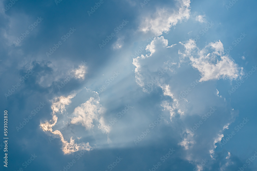 Divine glow through the clouds of the evening warm sun. Concept of peace and happiness. Divine glow through the clouds of the evening warm sun. Concept of peace and happiness.