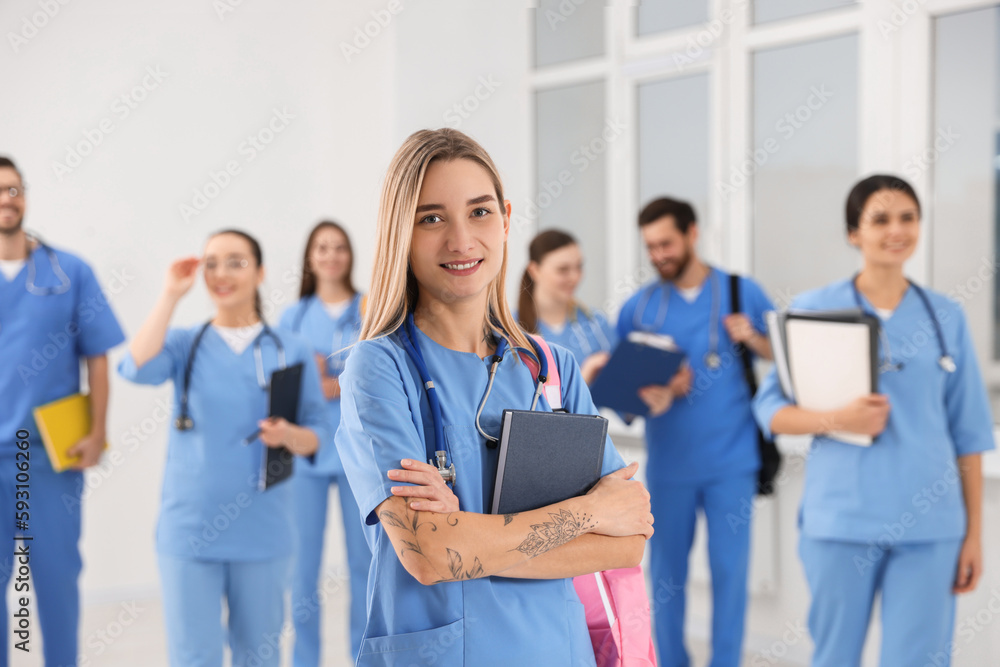 Young medical student with her classmates in university Young medical student with her classmates in university
