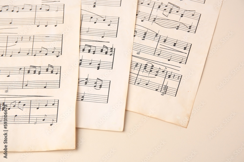 Obraz premium Sheets of paper with different notes on beige background, closeup