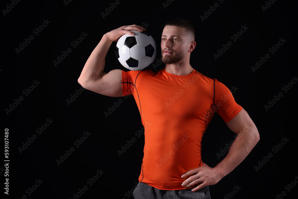 Athletic young man with soccer ball on black background Athletic young man with soccer ball on black background