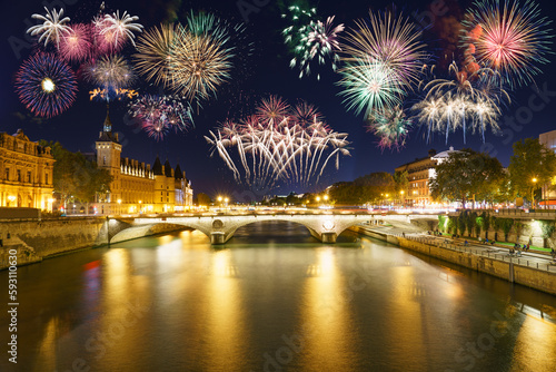 Fireworks show near Pont Change bridge and Conciergerie in Paris. France