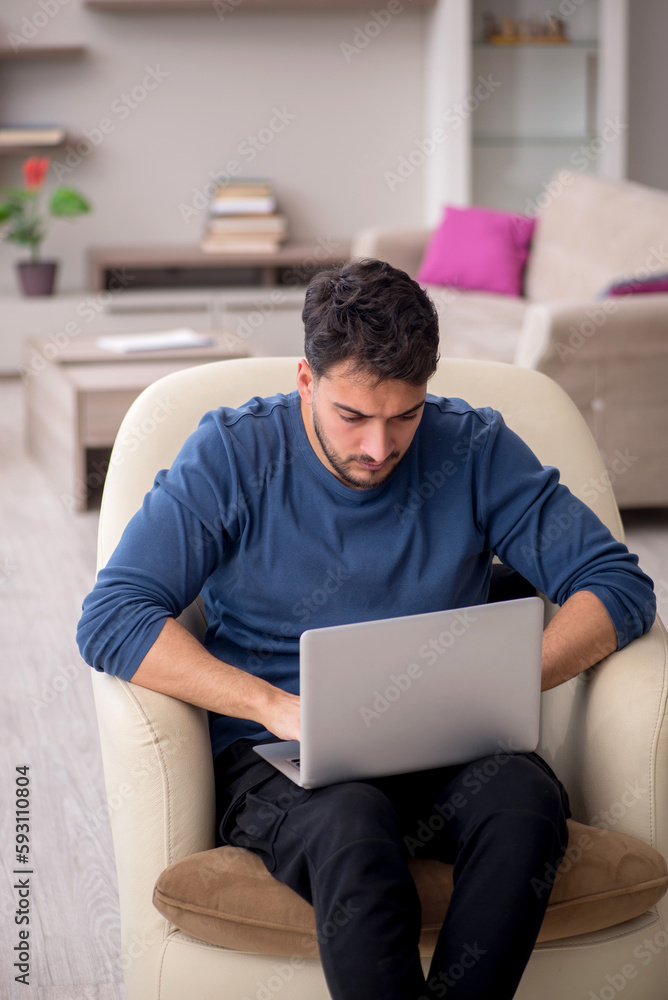 Young man working from home during pandemic Young man working from home during pandemic