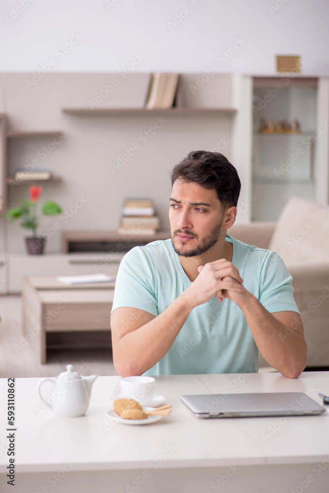 Young male freelancer working from home Young male freelancer working from home