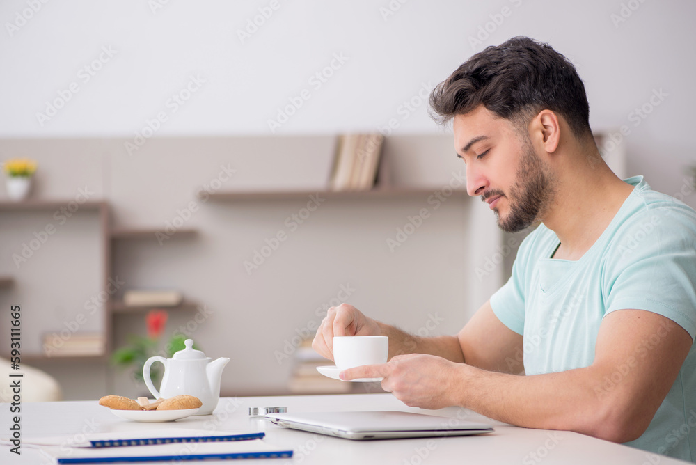Young male freelancer working from home Young male freelancer working from home