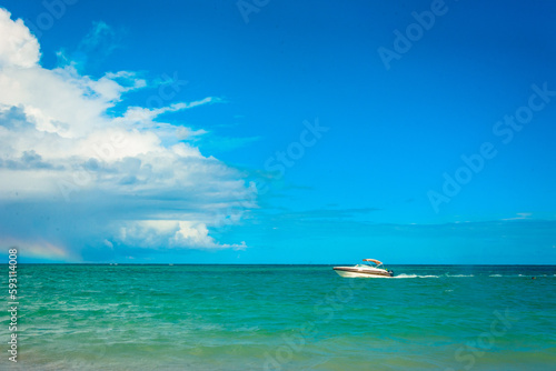 boat in the sea on a beautiful sunny day under a blue sky