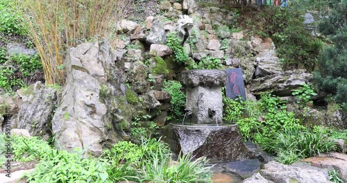 Dragon Spring (or Lung Quan in Chinese) near Dishui Cave or Dripping Water Cave in Shaoshan where Chairman Mao lived for a few days before cultural revolution in China photo