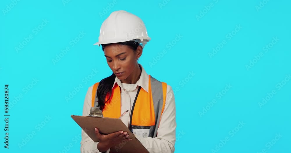Construction worker, inspection or woman writing on checklist for architecture on blue background. Safety papers, studio or Indian contractor with notes on building maintenance or renovation progress Construction worker, inspection or woman writing on checklist for architecture on blue background. Safety papers, studio or Indian contractor with notes on building maintenance or renovation progress