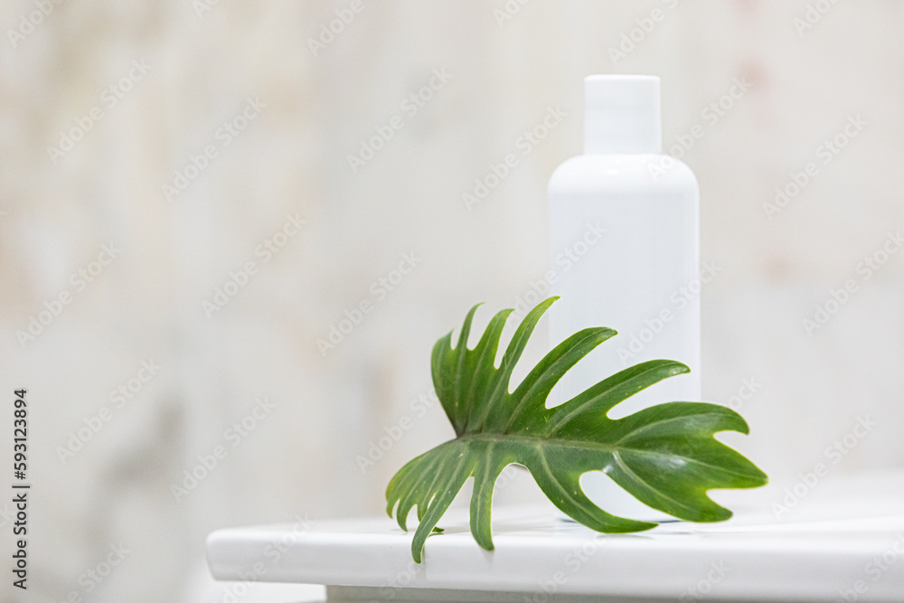 Skin care concept with white bottle and palm leaves on tropical background. Skin care concept with white bottle and palm leaves on tropical background.
