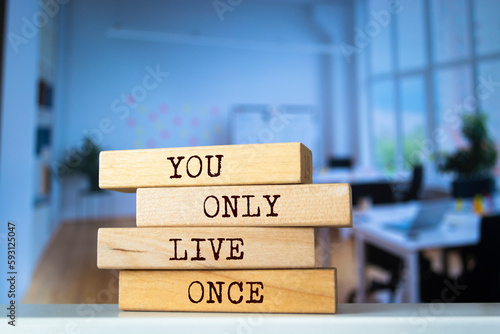 Wooden blocks with words 'You Only Live Once'.