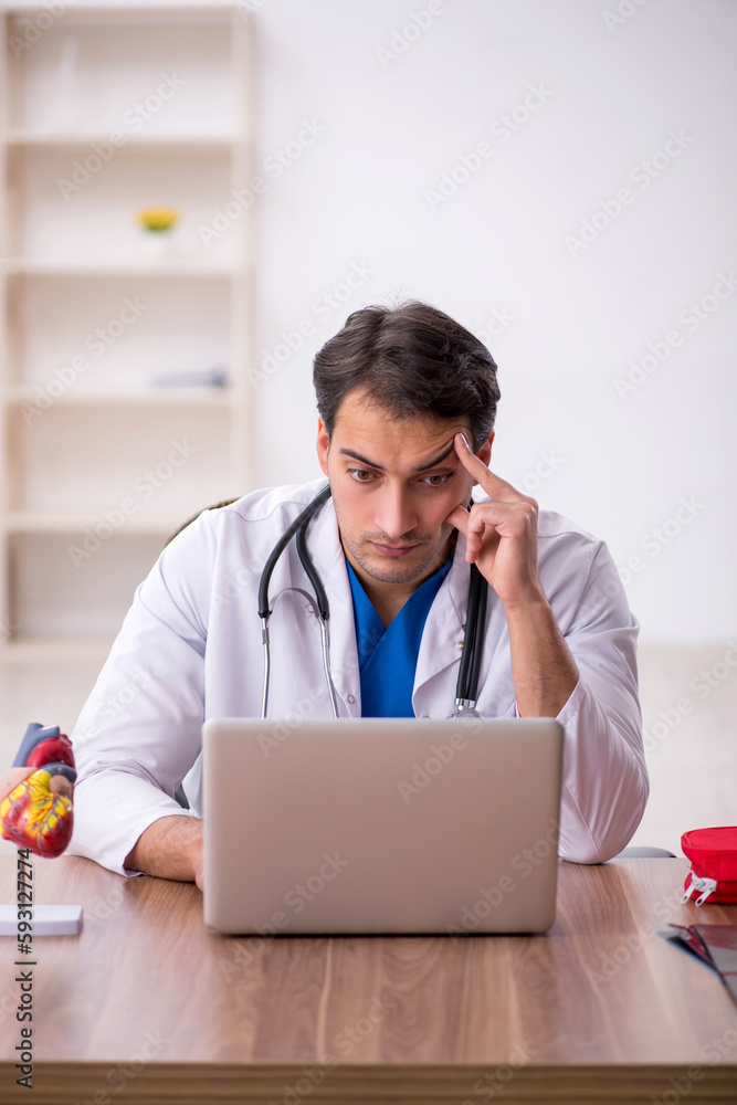 Young male doctor in telemedicine concept Young male doctor in telemedicine concept
