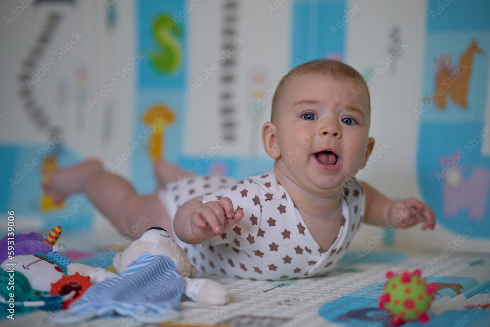 Portrait of a cute baby girl lying on the floor with toys. Portrait of a cute baby girl lying on the floor with toys.