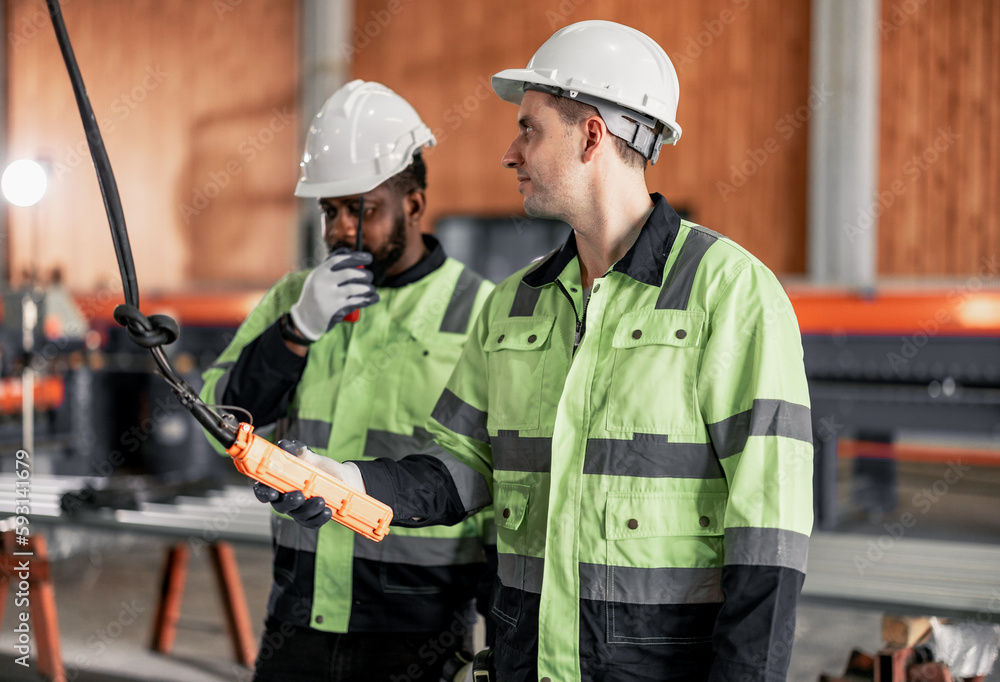 Experienced sheet metal workers use a computerized metalworking control