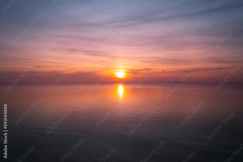 Background Sunset sky in the evening with orange-yellow over tropical sea coast paradise island sea nature