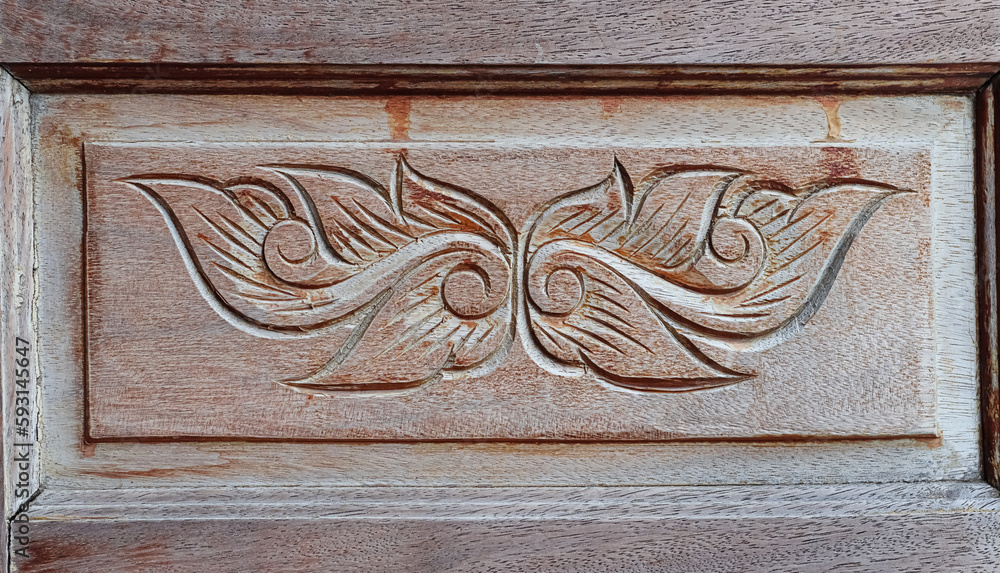 Close-up shot of carved wooden decorative door ornaments