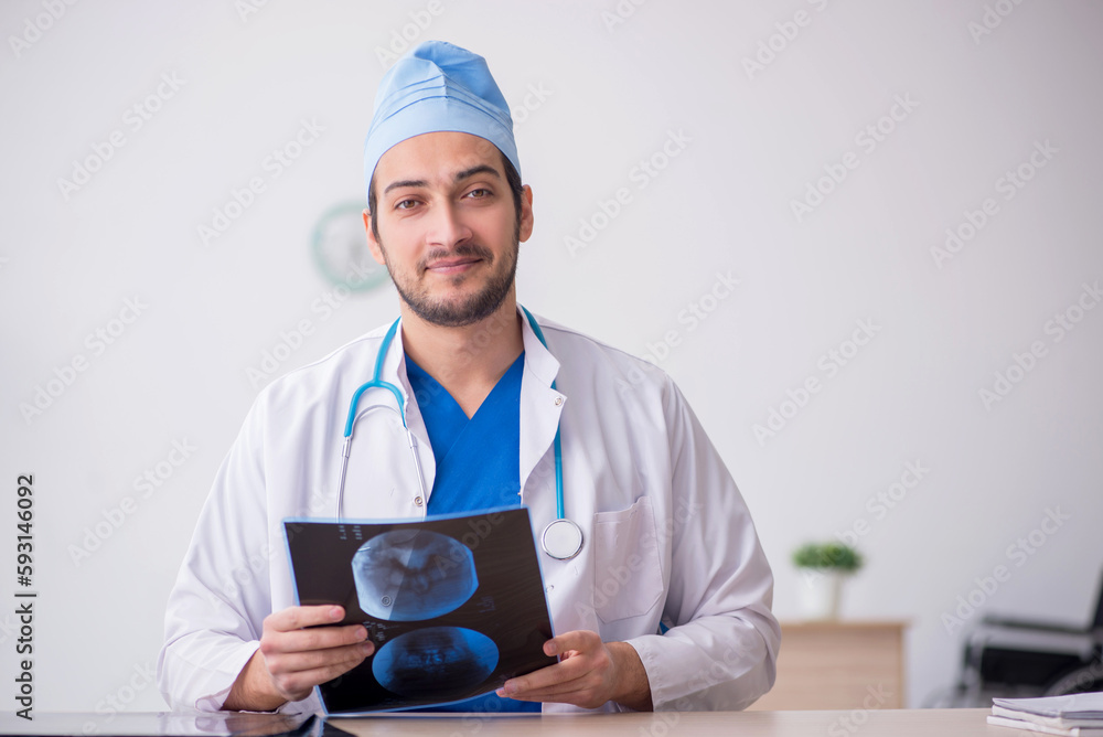 Young male doctor radiologist working in the clinic Young male doctor radiologist working in the clinic