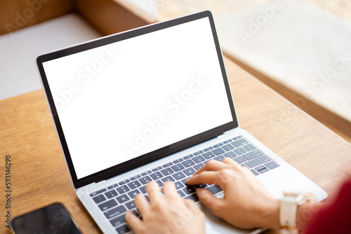 Isolation with clipping path. Young businesswoman working on laptop computer. Businesswoman using notebook computer to work. Empty white notebook screen, isolated with clipping path.