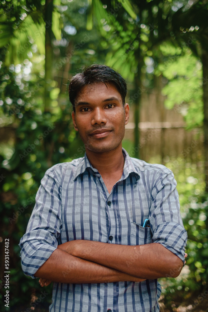 Portrait of a south asian young black village boy standing within nature Portrait of a south asian young black village boy standing within nature