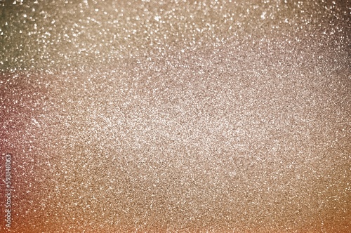 Abstract of shining bokeh glitters for background with copy space. Christmas and New Year wallpaper decorations concept