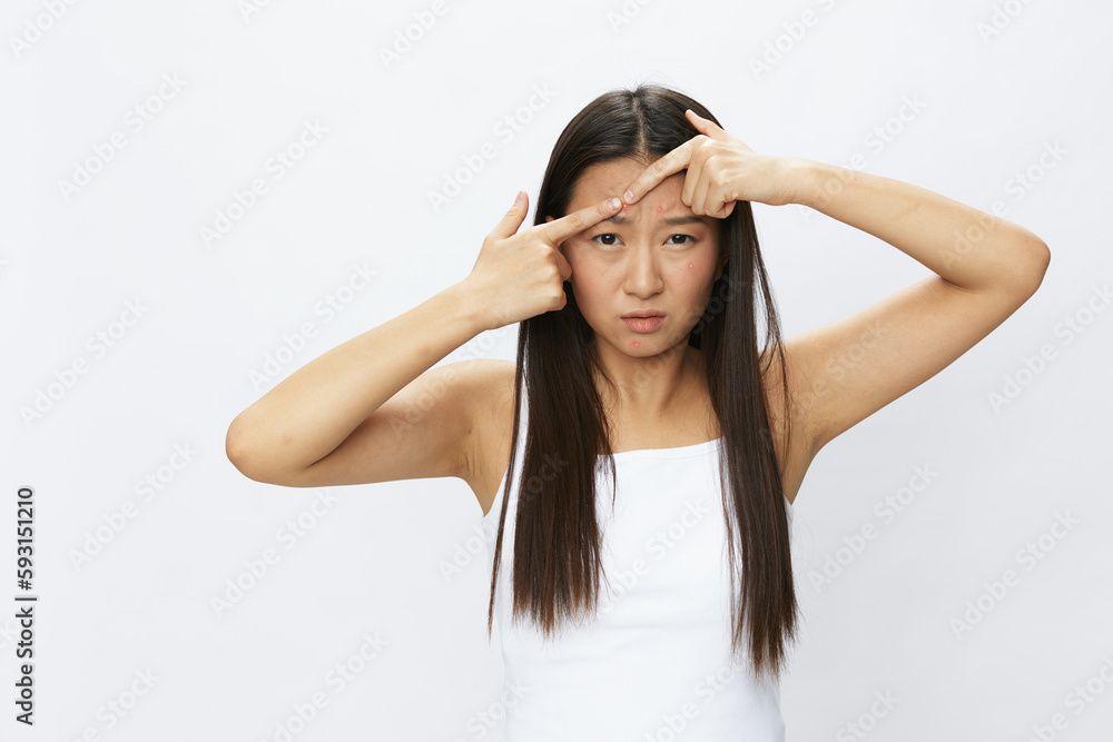 Asian woman facial skin problems, acne and inflammation, red rashes and allergies, chicken pox, sadness from rashes. Facial skin care concept for diseases and nerves Asian woman facial skin problems, acne and inflammation, red rashes and allergies, chicken pox, sadness from rashes. Facial skin care concept for diseases and nerves