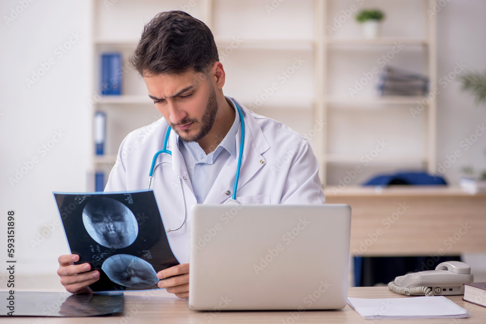 Young male doctor radiologist working in the clinic Young male doctor radiologist working in the clinic
