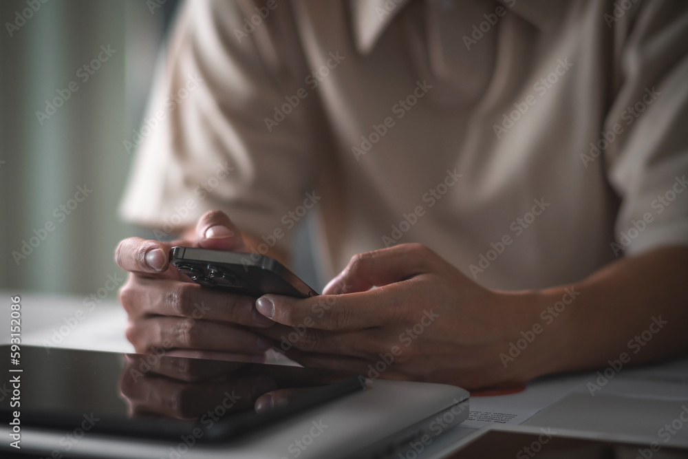 Close up of student hands using smart phone electronic learning. E-learning technology concept Close up of student hands using smart phone electronic learning. E-learning technology concept