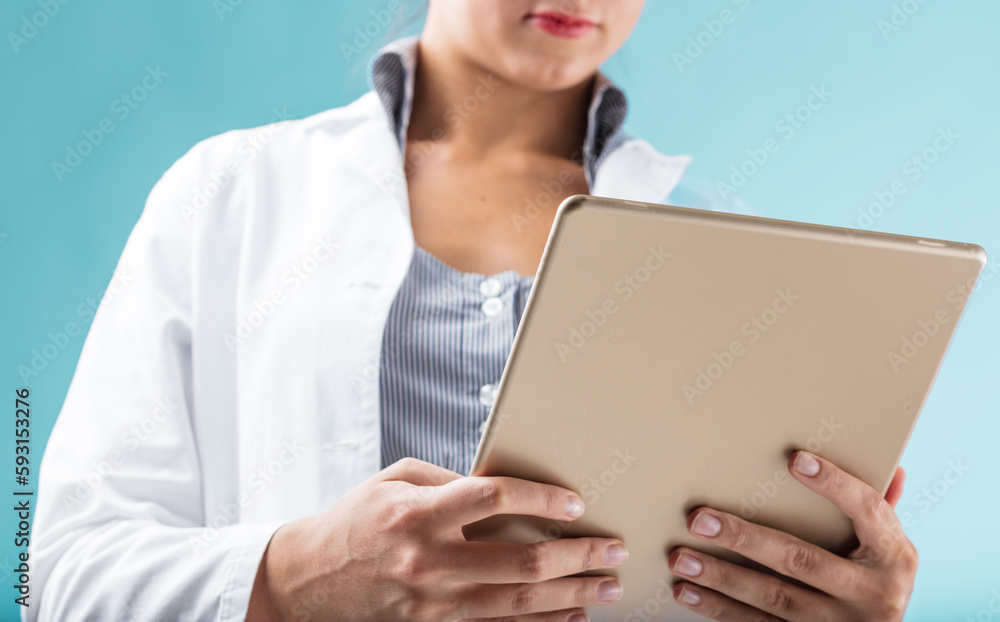 Female hands, digital tablet, flames, white lab coat, modern wor Female hands, digital tablet, flames, white lab coat, modern wor
