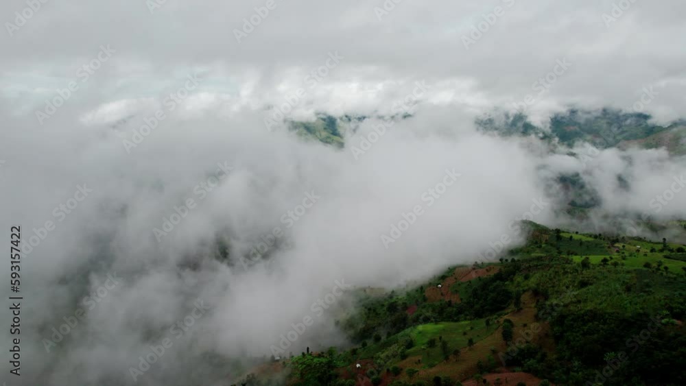 Top view Landscape of Morning Mist with Mountain Layer at north of Thailand. mountain ridge and clouds in rural jungle bush forest Top view Landscape of Morning Mist with Mountain Layer at north of Thailand. mountain ridge and clouds in rural jungle bush forest