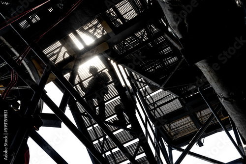 Fotografie Climbing stairs on an oil platform
