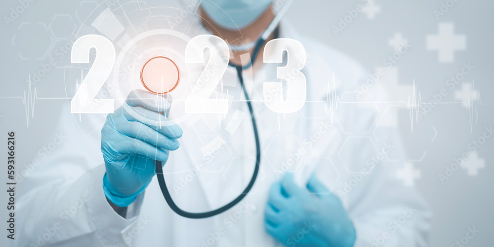 Concept New Year 2023 in medicine and healthcare, Doctor or scientist with a stethoscope Wearing Medical Mask in the white background, health insurance,medical secret, emergency online medical Concept New Year 2023 in medicine and healthcare, Doctor or scientist with a stethoscope Wearing Medical Mask in the white background, health insurance,medical secret, emergency online medical