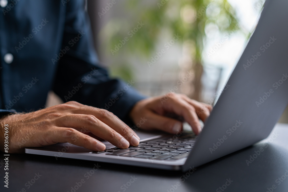 Businessman hands using laptop in office Businessman hands using laptop in office