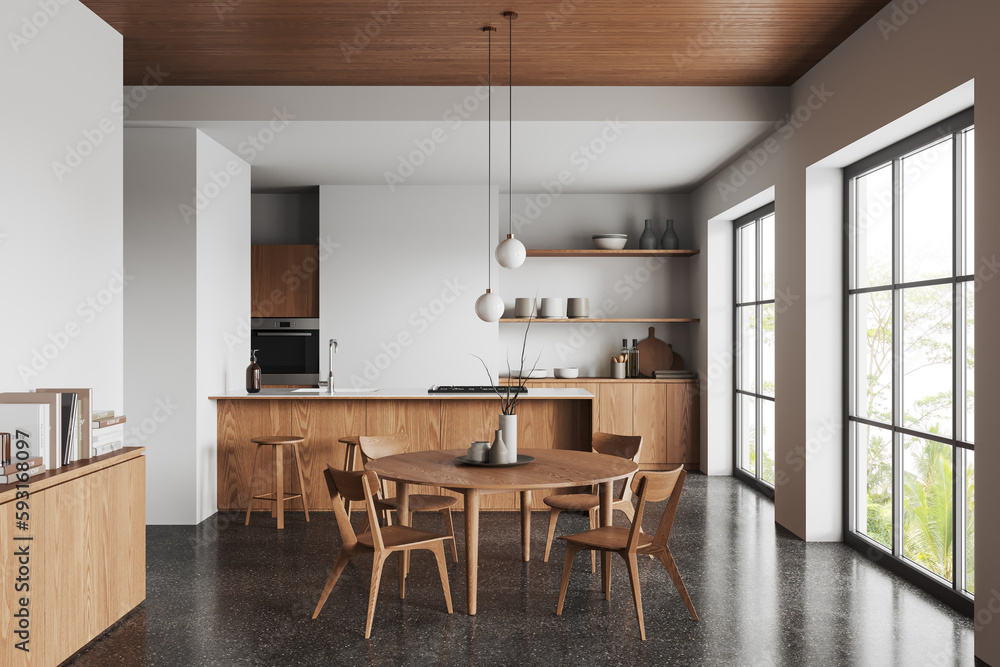 Fototapeta premium Light kitchen interior with dinner table and bar countertop, panoramic window
