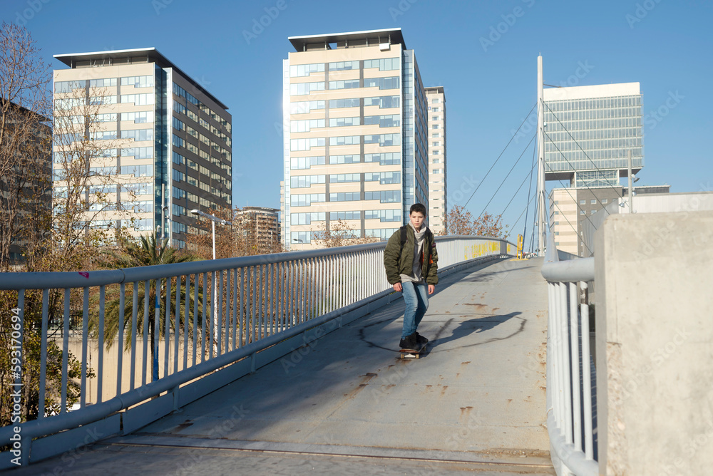 young man playing skateboard on street city. young man playing skateboard on street city.